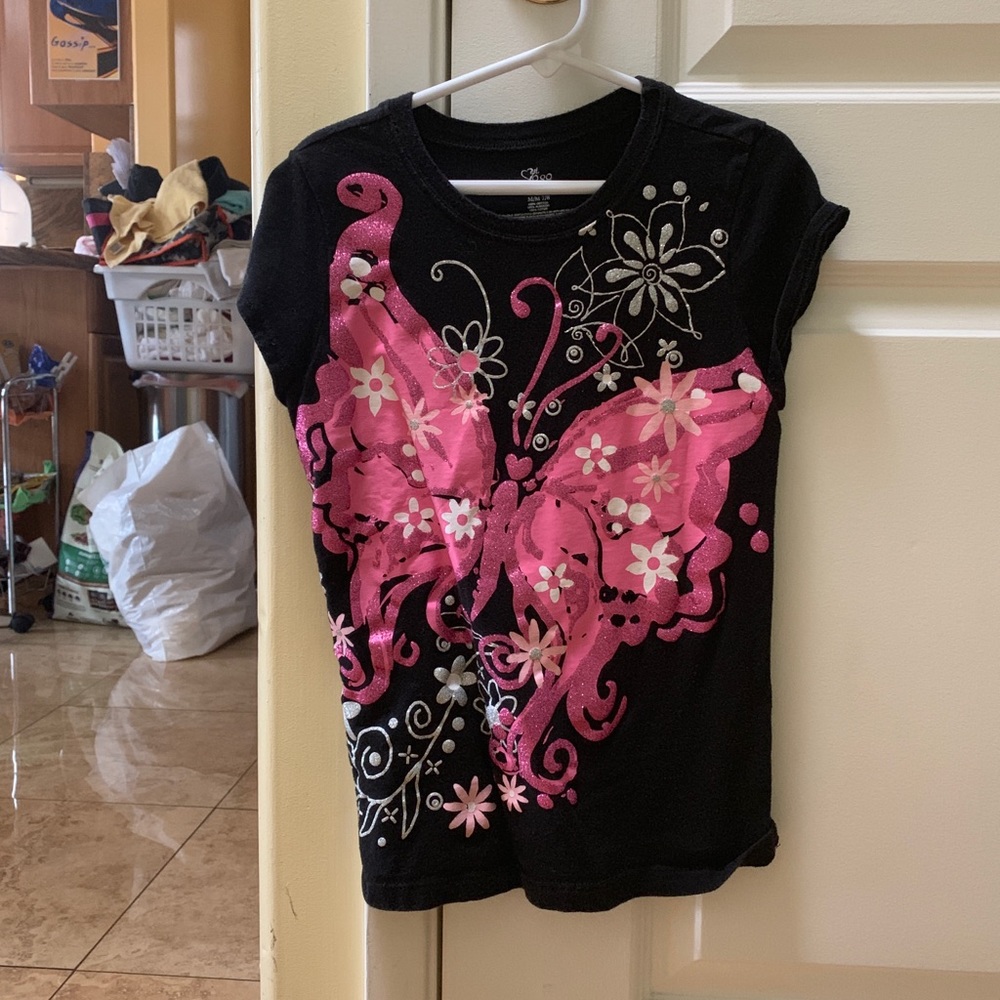 Black shirt with a pink butterfly
